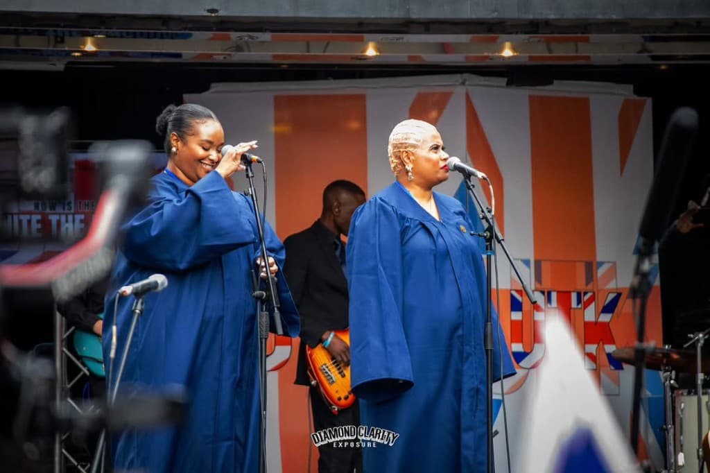UTK Collective singers performing in blue choir robes