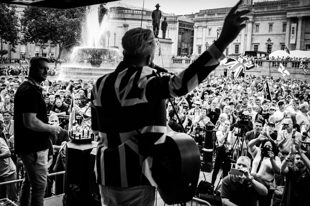 UTK performer facing a packed Trafalgar Square crowd